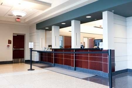 an empty lobby with a check in counter.