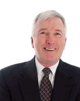 a man in a suit and tie posing for a picture.